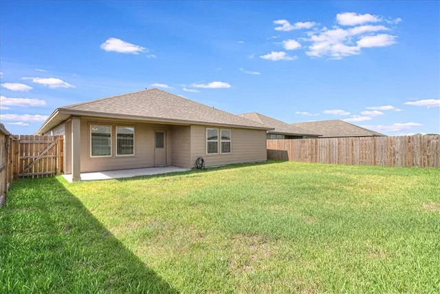 a view of an ocean and a yard