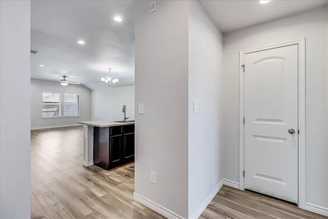 a view of a kitchen from the hallway