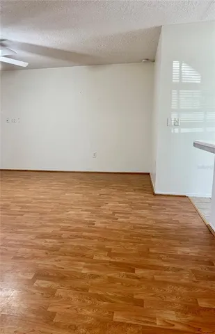 a view of room with wooden floor