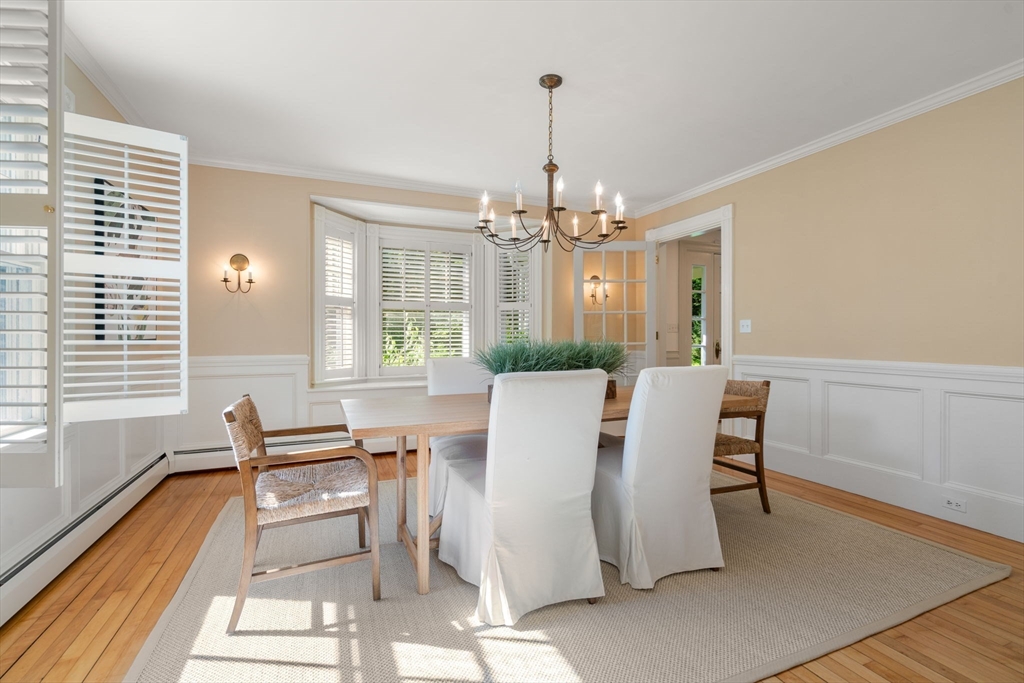 15 Training Field Road Wayland, MA 01778 - Photo 12 of 37 a view of a dining room with furniture and wooden floor