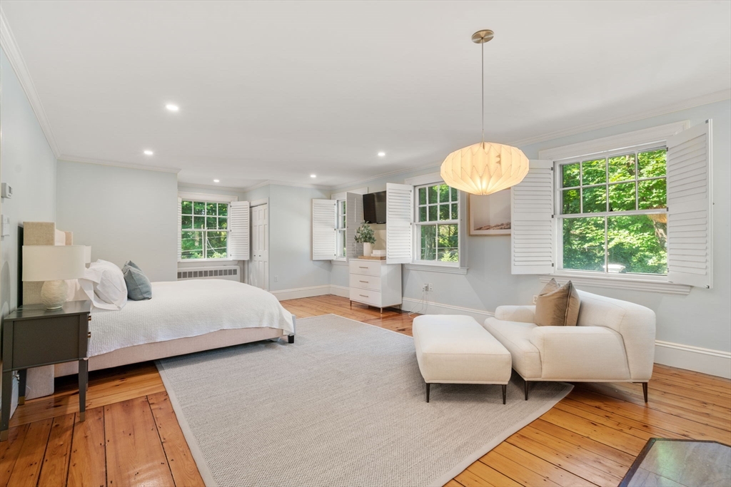 15 Training Field Road Wayland, MA 01778 - Photo 21 of 37 a spacious bedroom with a bed and a couch
