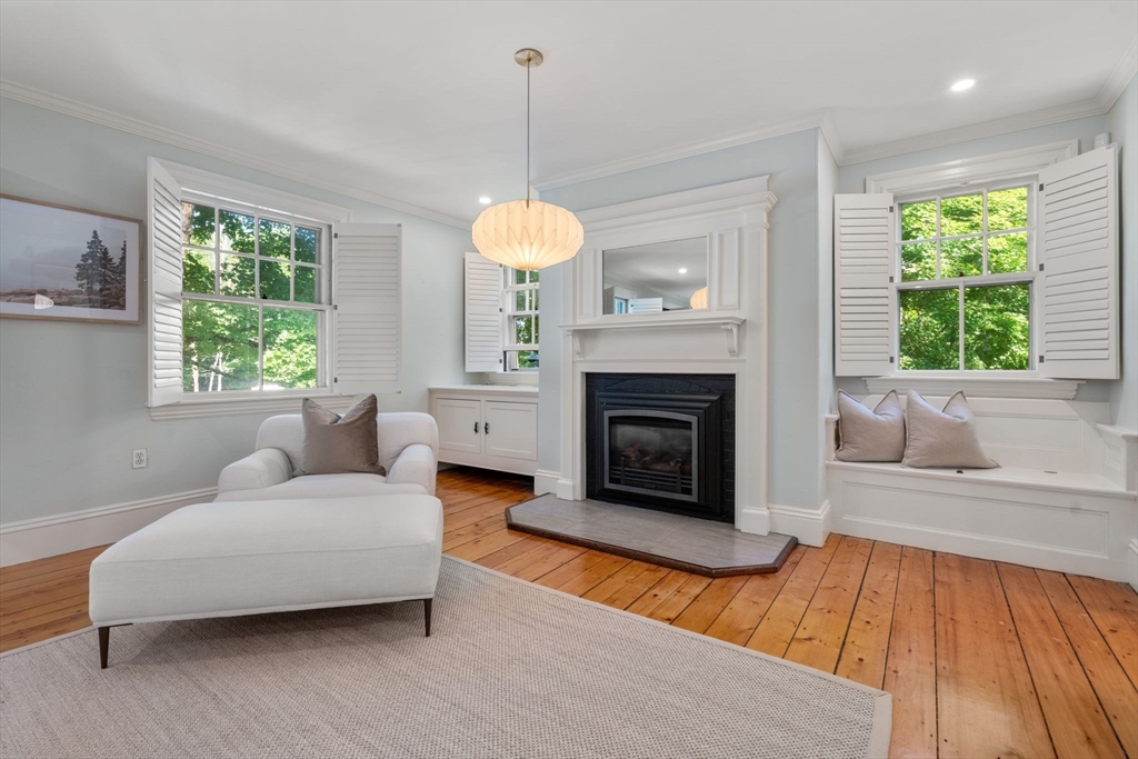 15 Training Field Road Wayland, MA 01778 - Photo 23 of 37 a living room with furniture and a fireplace