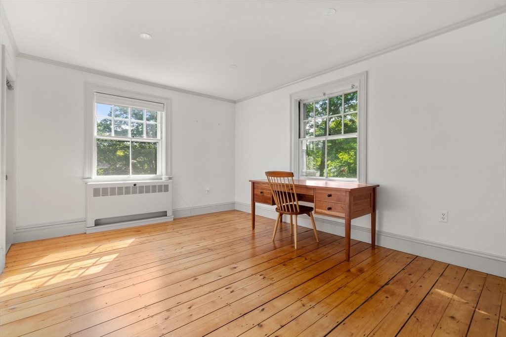 15 Training Field Road Wayland, MA 01778 - Photo 25 of 37 a workspace room with wooden floor lounge chair and windows