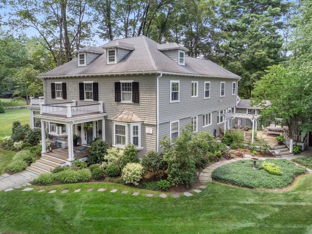 15 Training Field Road Wayland, MA 01778 - Photo 3 of 37 a front view of a house with a yard and green space
