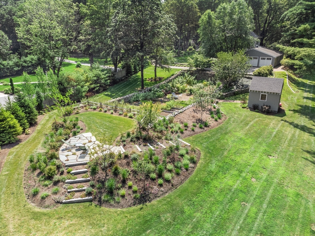 15 Training Field Road Wayland, MA 01778 - Photo 32 of 37 a view of a garden with a fountain