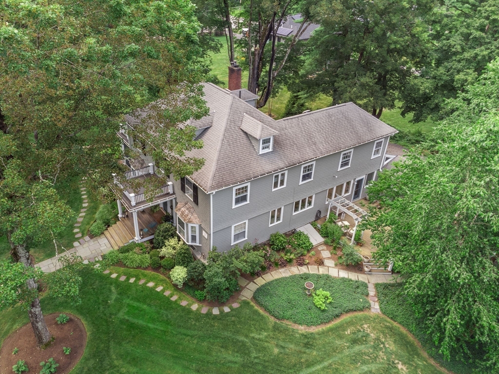 15 Training Field Road Wayland, MA 01778 - Photo 5 of 37 a aerial view of a house with yard and trees in the background
