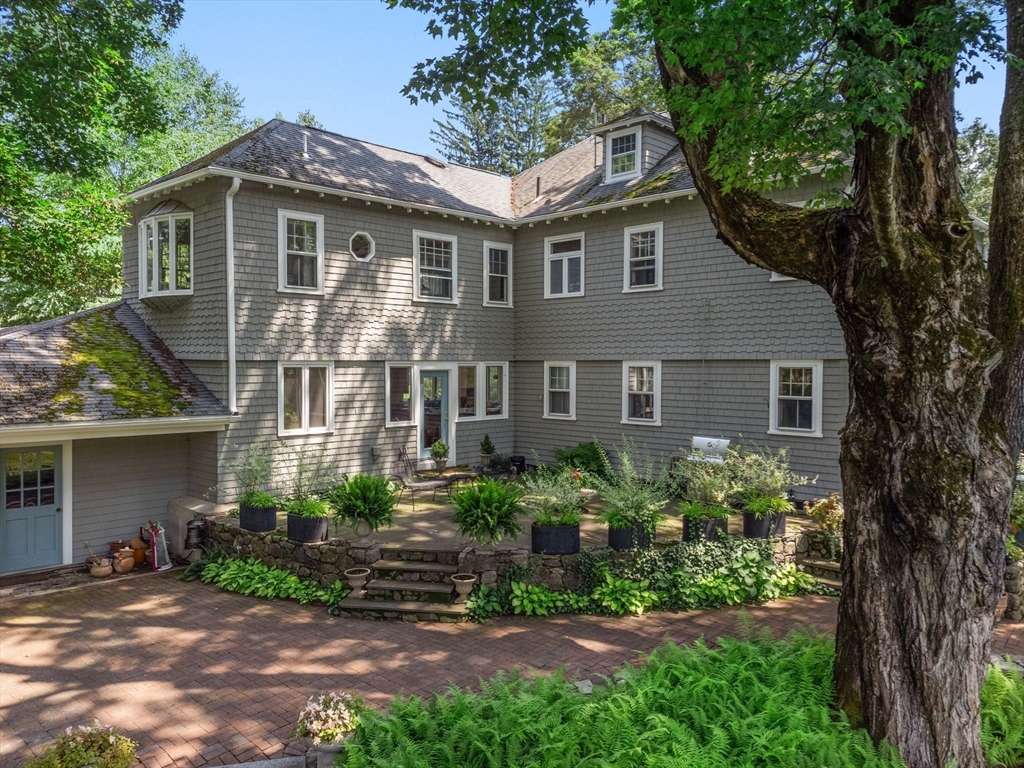 15 Training Field Road Wayland, MA 01778 - Photo 8 of 37 a front view of a house with a garden