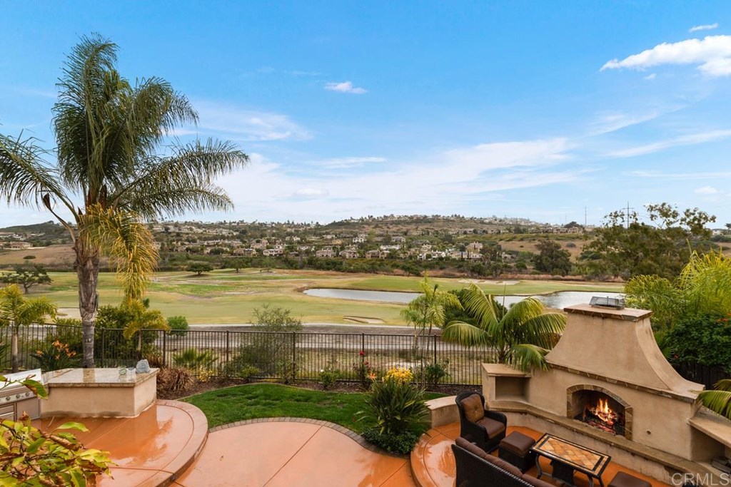 Fabulous La Costa golf course views from the backyard with built in BBQ, fireplace and sitting areas