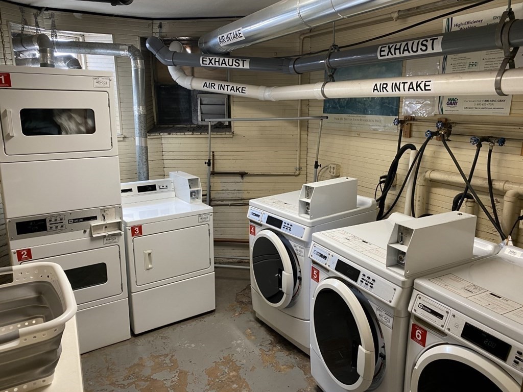 36 Winchester Street, Unit 2 Brookline, MA 02446 - Photo 11 of 18 a utility room with dryer and washer