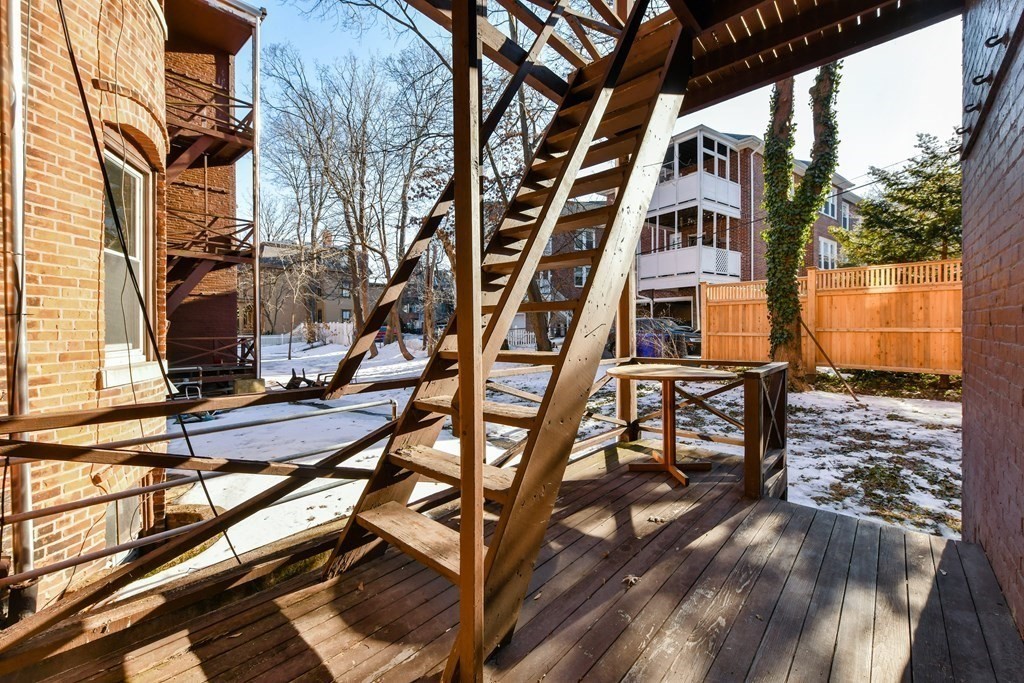 36 Winchester Street, Unit 2 Brookline, MA 02446 - Photo 12 of 18 a front view of a house with balcony and trees