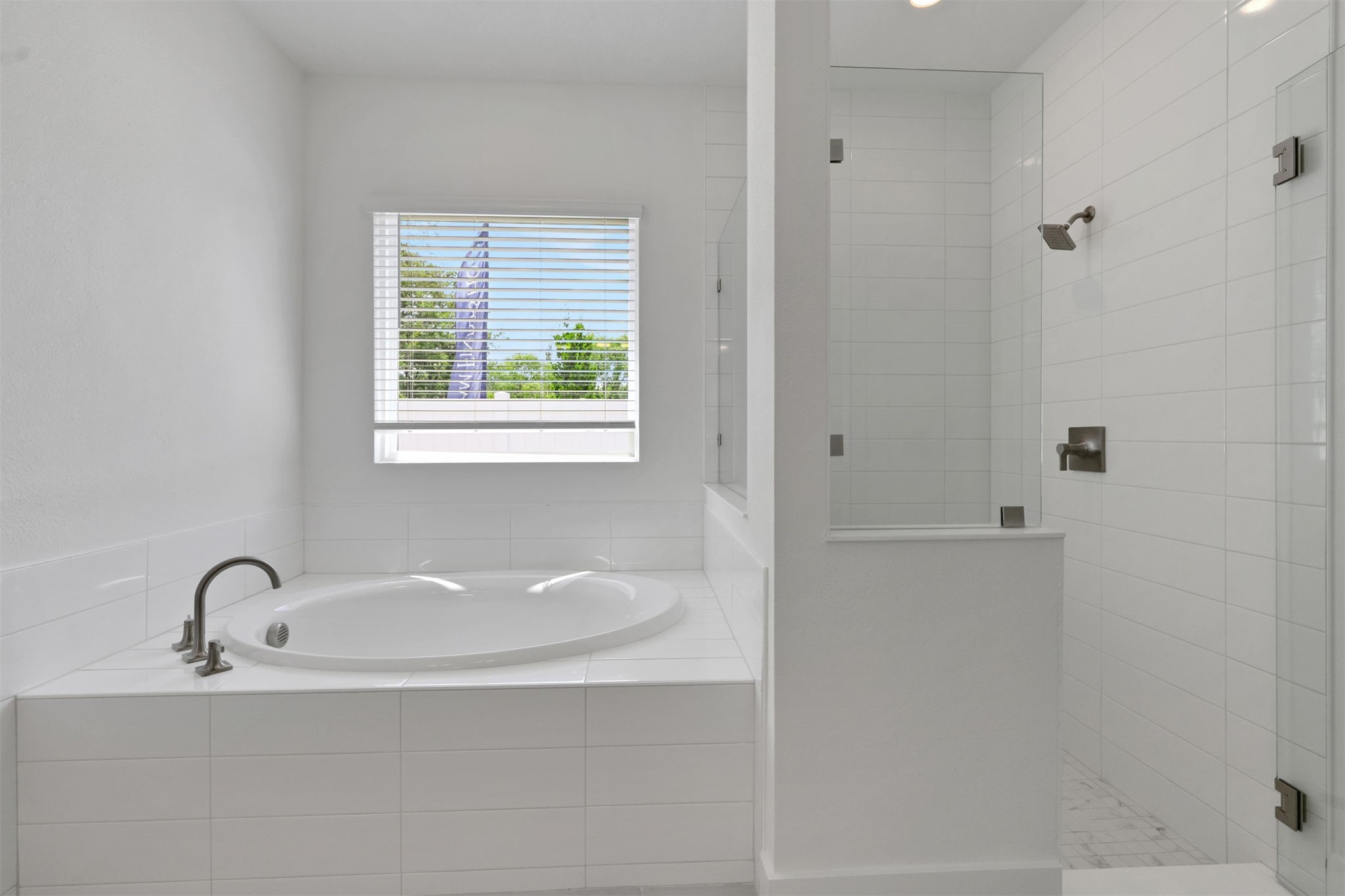 96040 Pirates Bluff Road Yulee, FL 32097 - Photo 3 of 38 a white bath tub sitting in a bathroom next to a window