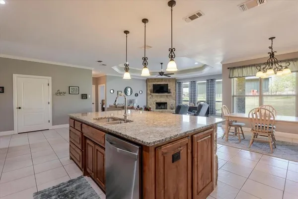 a dining hall with a table and chairs