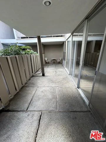 a view of a porch with seating space