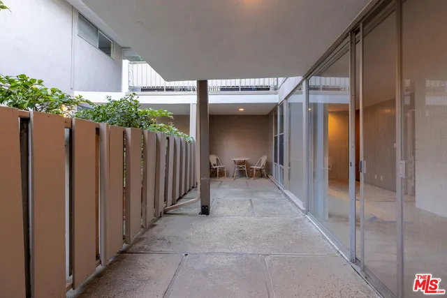 a bathroom with a shower and a toilet