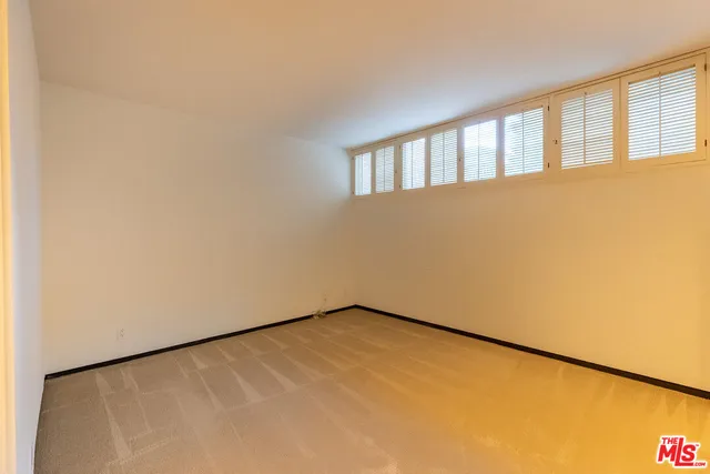 a view of a bathroom from a corridor