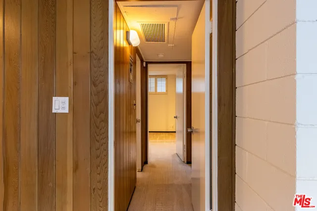 a view of a kitchen from the hallway