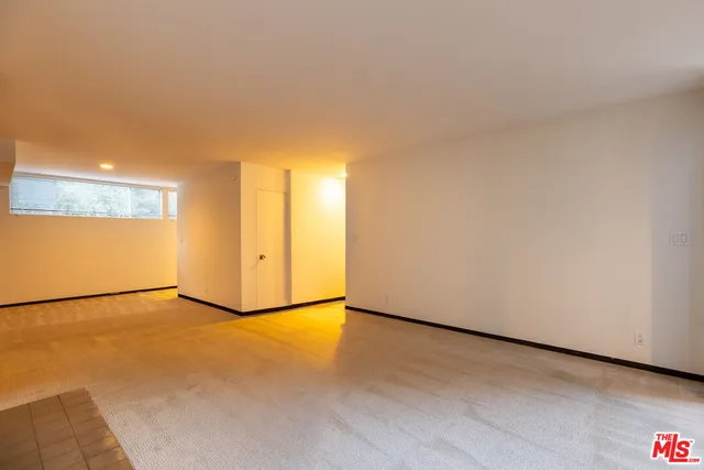 a view of a path along with potted plants