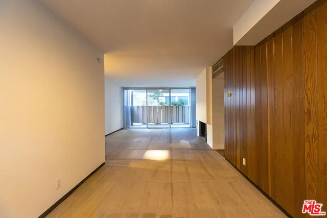 a view of a kitchen with a stove top oven