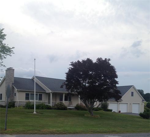 4 Randall Road Berlin, MA 01503 - Photo 1 of 13 a front view of a house with a garden and trees