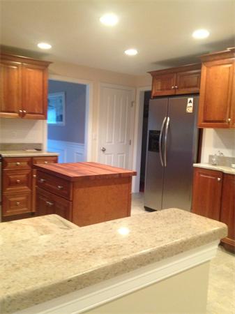 4 Randall Road Berlin, MA 01503 - Photo 3 of 13 a kitchen with stainless steel appliances granite countertop a refrigerator a sink and a stove