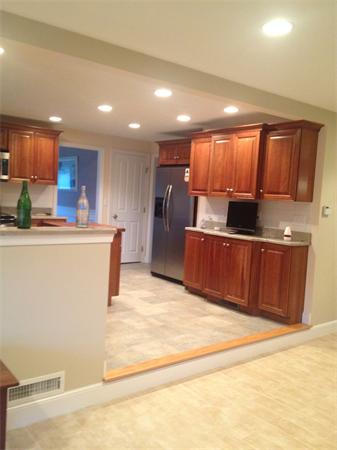 4 Randall Road Berlin, MA 01503 - Photo 4 of 13 a kitchen with stainless steel appliances wooden cabinets a sink and a refrigerator