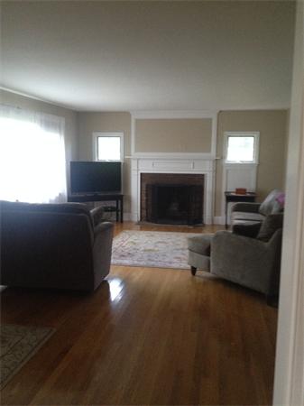 4 Randall Road Berlin, MA 01503 - Photo 7 of 13 a living room with furniture a fireplace and a flat screen tv
