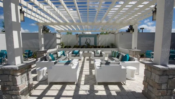 a view of a patio with couches and chairs