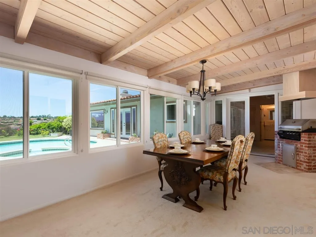 5486 Soledad Road La Jolla, CA 92037 - Photo 11 of 25 a view of a dining room with furniture window and outside view