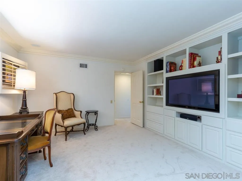 5486 Soledad Road La Jolla, CA 92037 - Photo 18 of 25 a living room with furniture and a flat screen tv