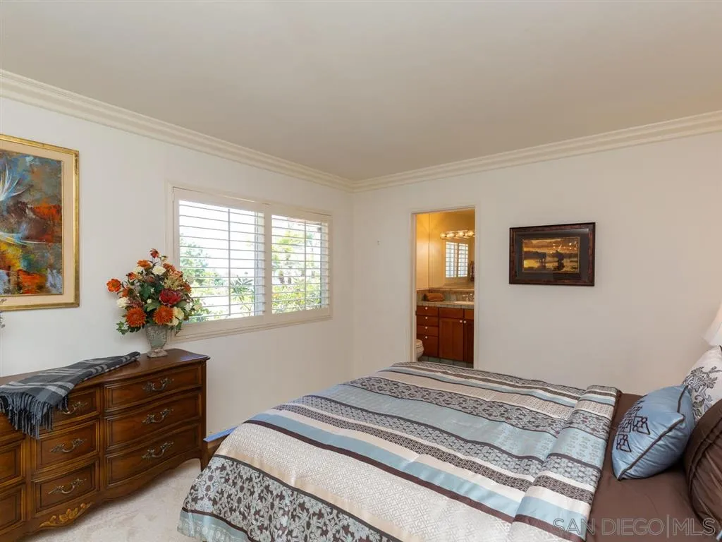 5486 Soledad Road La Jolla, CA 92037 - Photo 20 of 25 a bedroom with a bed and a dresser