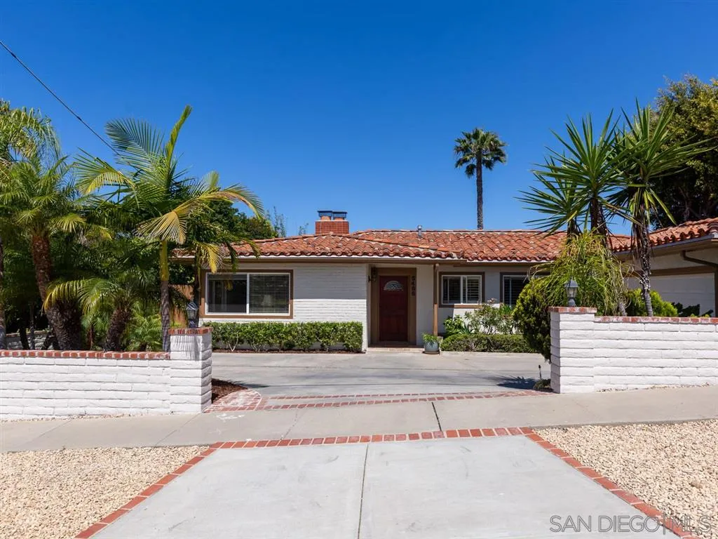 5486 Soledad Road La Jolla, CA 92037 - Photo 3 of 25 a front view of a house with a yard and garage