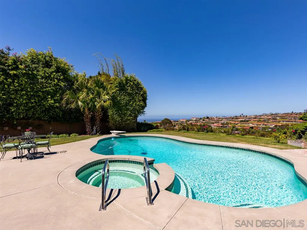 5486 Soledad Road La Jolla, CA 92037 - Photo 5 of 25 a view of a swimming pool with a yard