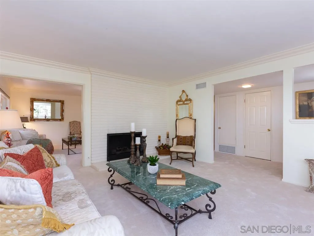 5486 Soledad Road La Jolla, CA 92037 - Photo 6 of 25 a living room with furniture and a flat screen tv