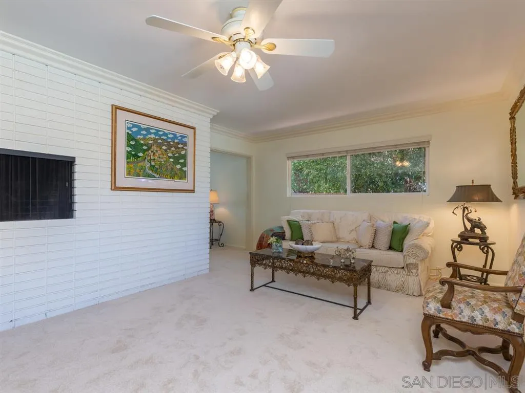 5486 Soledad Road La Jolla, CA 92037 - Photo 7 of 25 a living room with furniture and a large window