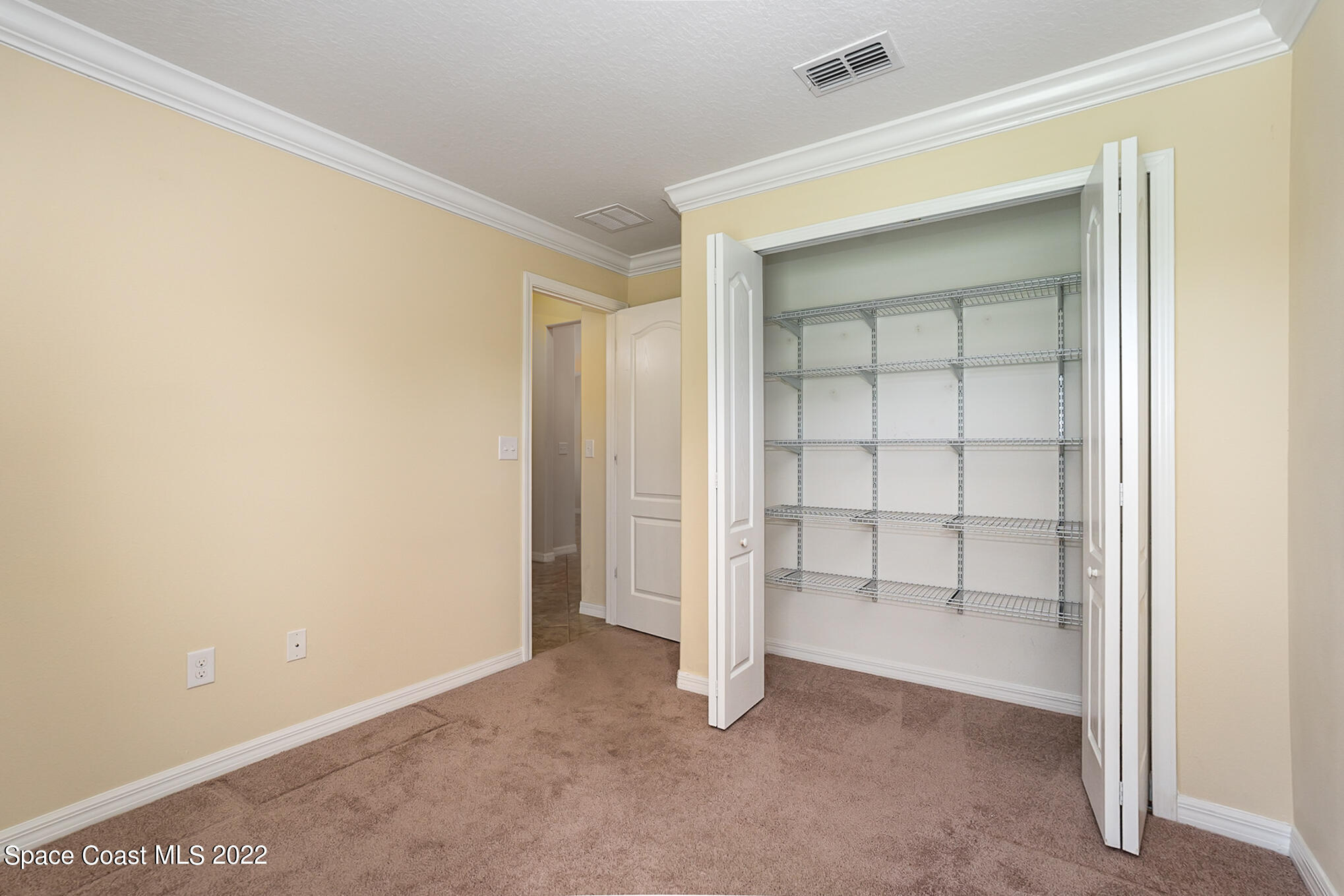 7251 Ralston Street Melbourne, FL 32940 - Photo 16 of 35 Closet with Add'l Shelves 2nd bedroom
