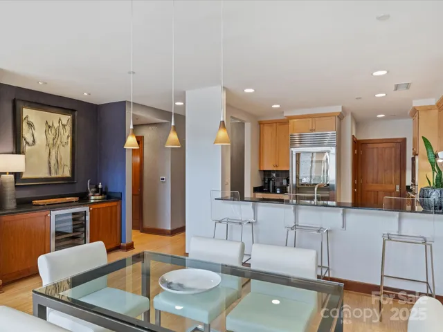 a living room with furniture and large window