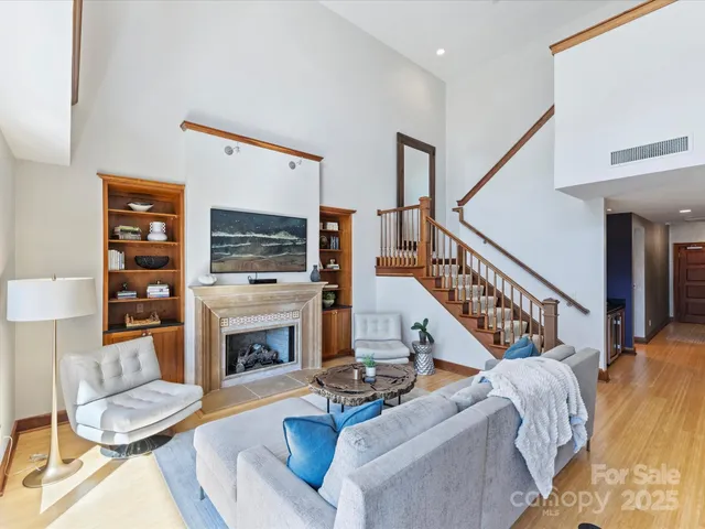 a living room with furniture fireplace and a flat screen tv