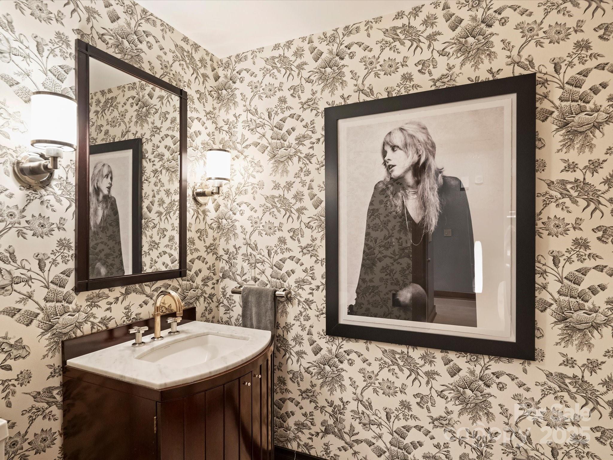 435 South Tryon Street, Unit 307 Charlotte, NC 28202 - Photo 26 of 48 a bathroom with a sink and a mirror