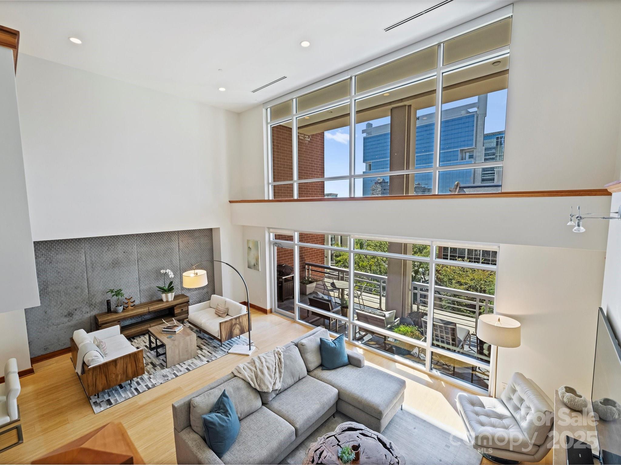 435 South Tryon Street, Unit 307 Charlotte, NC 28202 - Photo 27 of 48 a living room with furniture