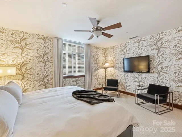 a living room with a couch and a flat screen tv