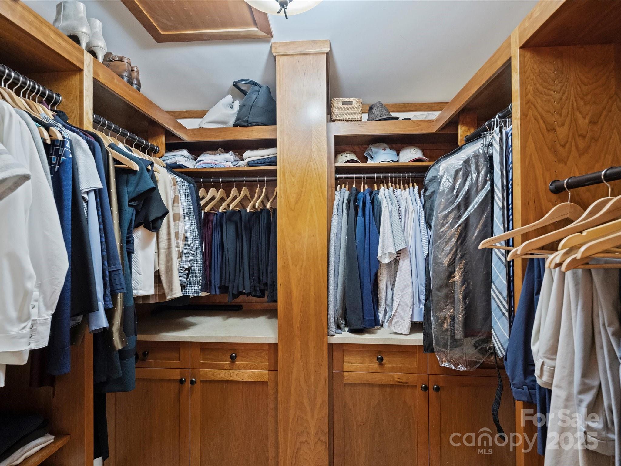 435 South Tryon Street, Unit 307 Charlotte, NC 28202 - Photo 37 of 48 a view of walk in closet with clothes and shoes