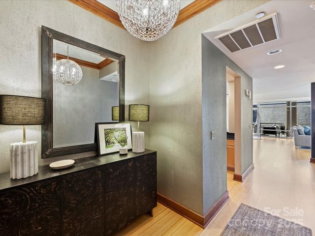 a view of living room with furniture and a mirror