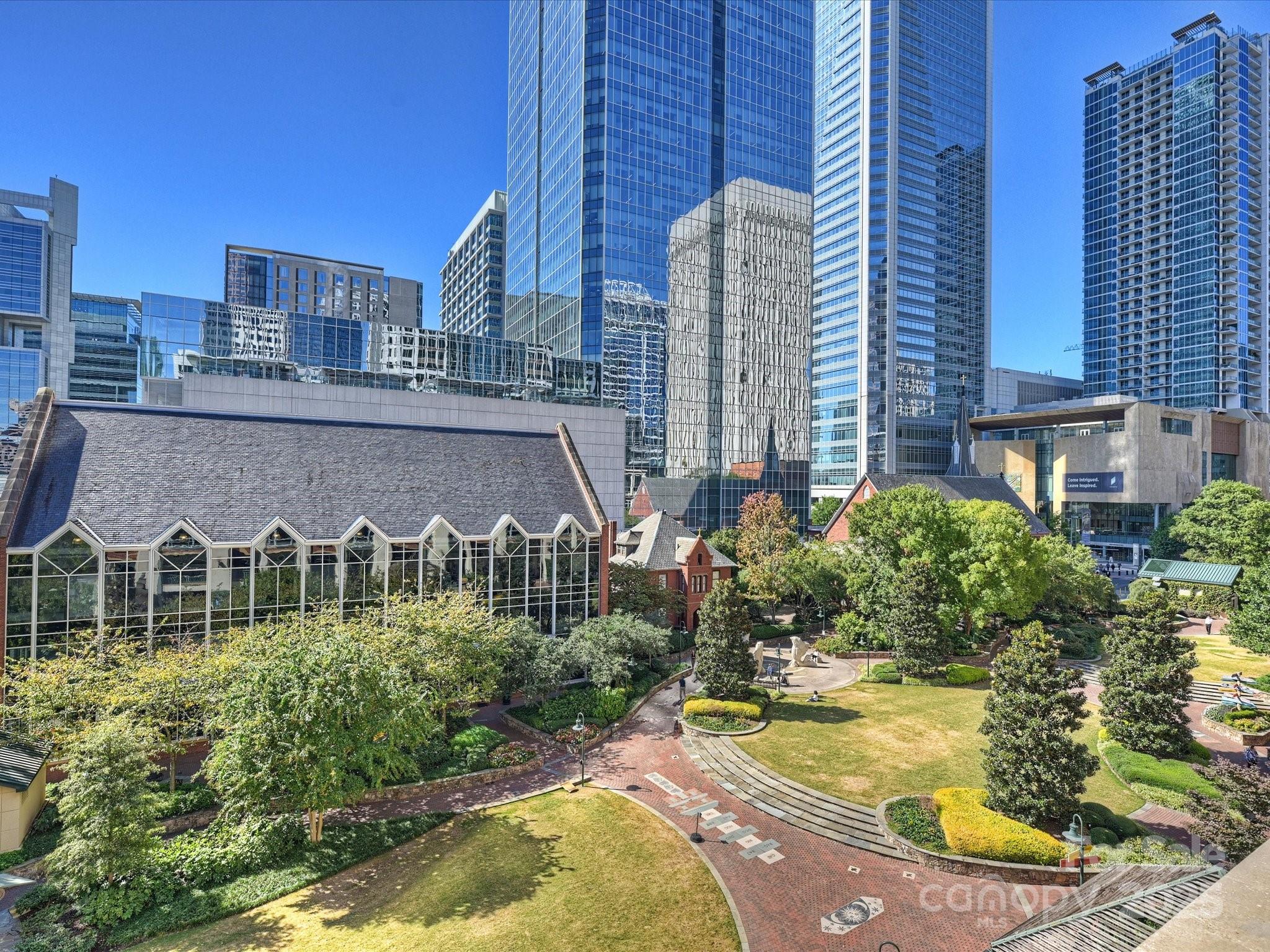 435 South Tryon Street, Unit 307 Charlotte, NC 28202 - Photo 41 of 48 a view of a swimming pool next to a building
