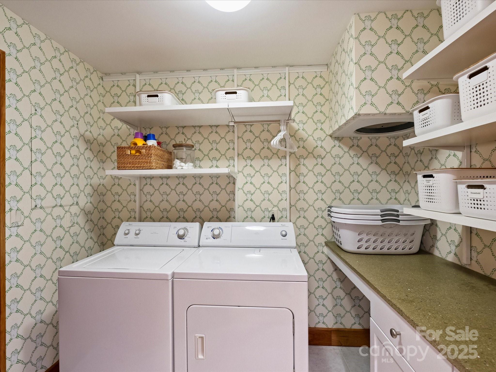 435 South Tryon Street, Unit 307 Charlotte, NC 28202 - Photo 47 of 48 a utility room with dryer and washer