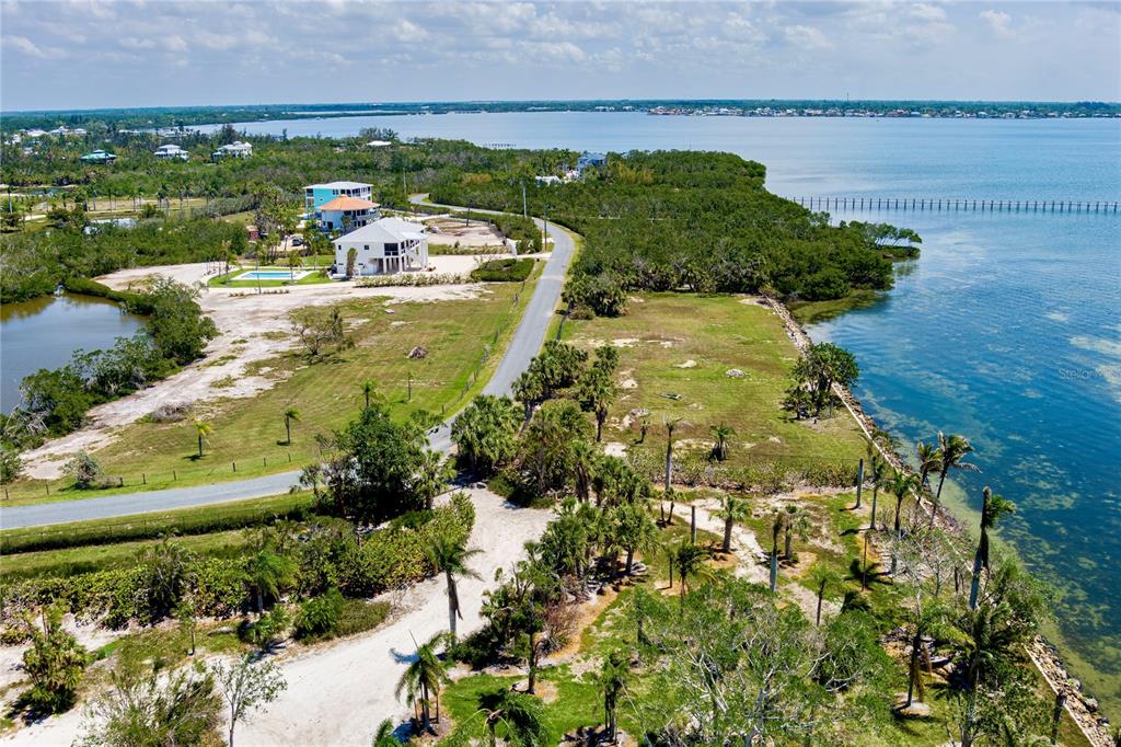 285 Horseshoe Loop Road Terra Ceia, FL 34250 - Photo 10 of 16 a view of a lake with a building in the background