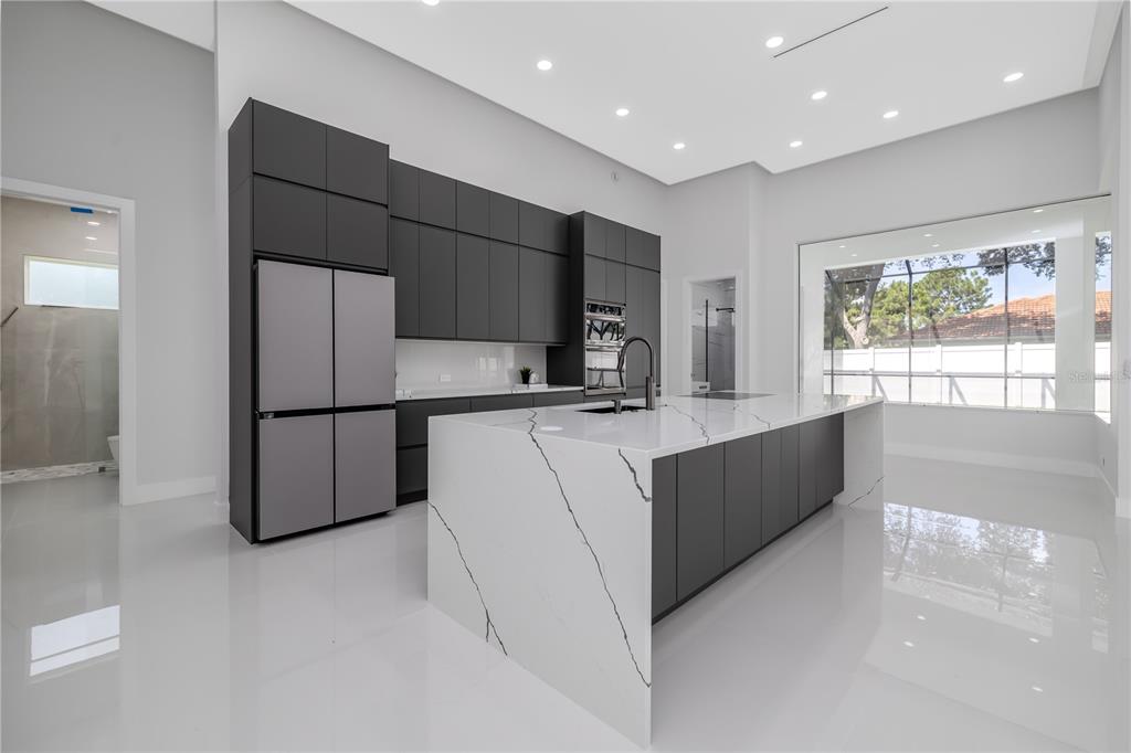 6 Rockne Lane Palm Coast, FL 32164 - Photo 15 of 24 a kitchen with stainless steel appliances a refrigerator and a sink