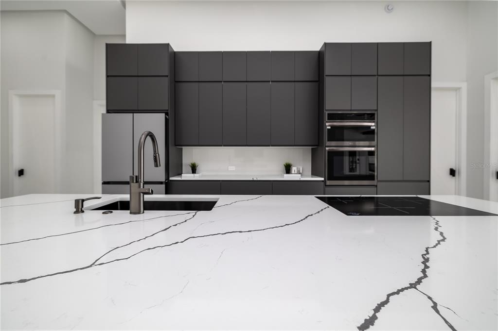 6 Rockne Lane Palm Coast, FL 32164 - Photo 16 of 24 a kitchen with a refrigerator and a sink