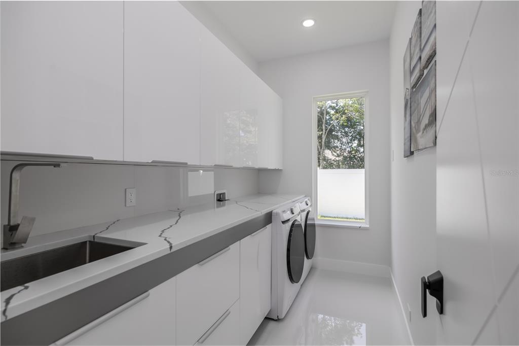 6 Rockne Lane Palm Coast, FL 32164 - Photo 20 of 24 a kitchen with a sink cabinets and window