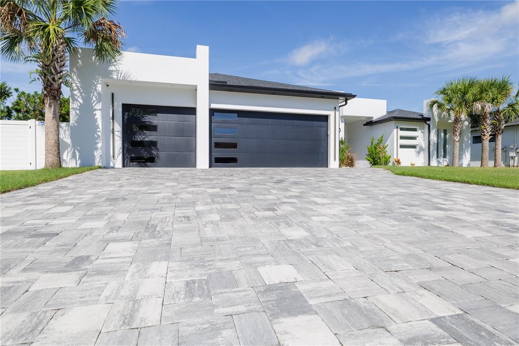 6 Rockne Lane Palm Coast, FL 32164 - Photo 6 of 24 a view of a house with a yard and garage
