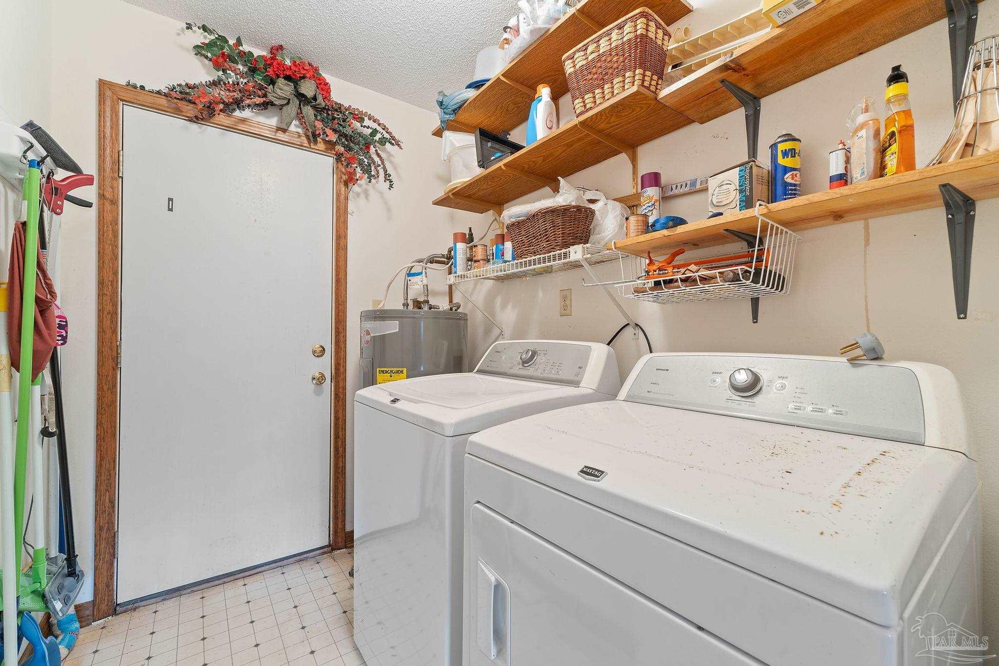 2329 Camors Road Jay, FL 32565 - Photo 13 of 28 a utility room with dryer and washer